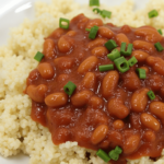 "Ingredients for homemade baked beans including navy beans, onions, bell peppers, and molasses